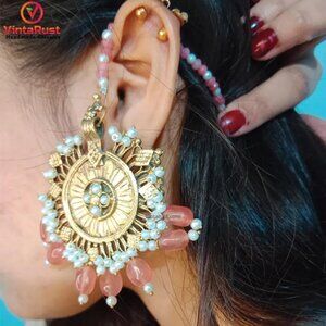 Golden Dangling Earrings with Pearl Embellishments and Pink Bead Details
